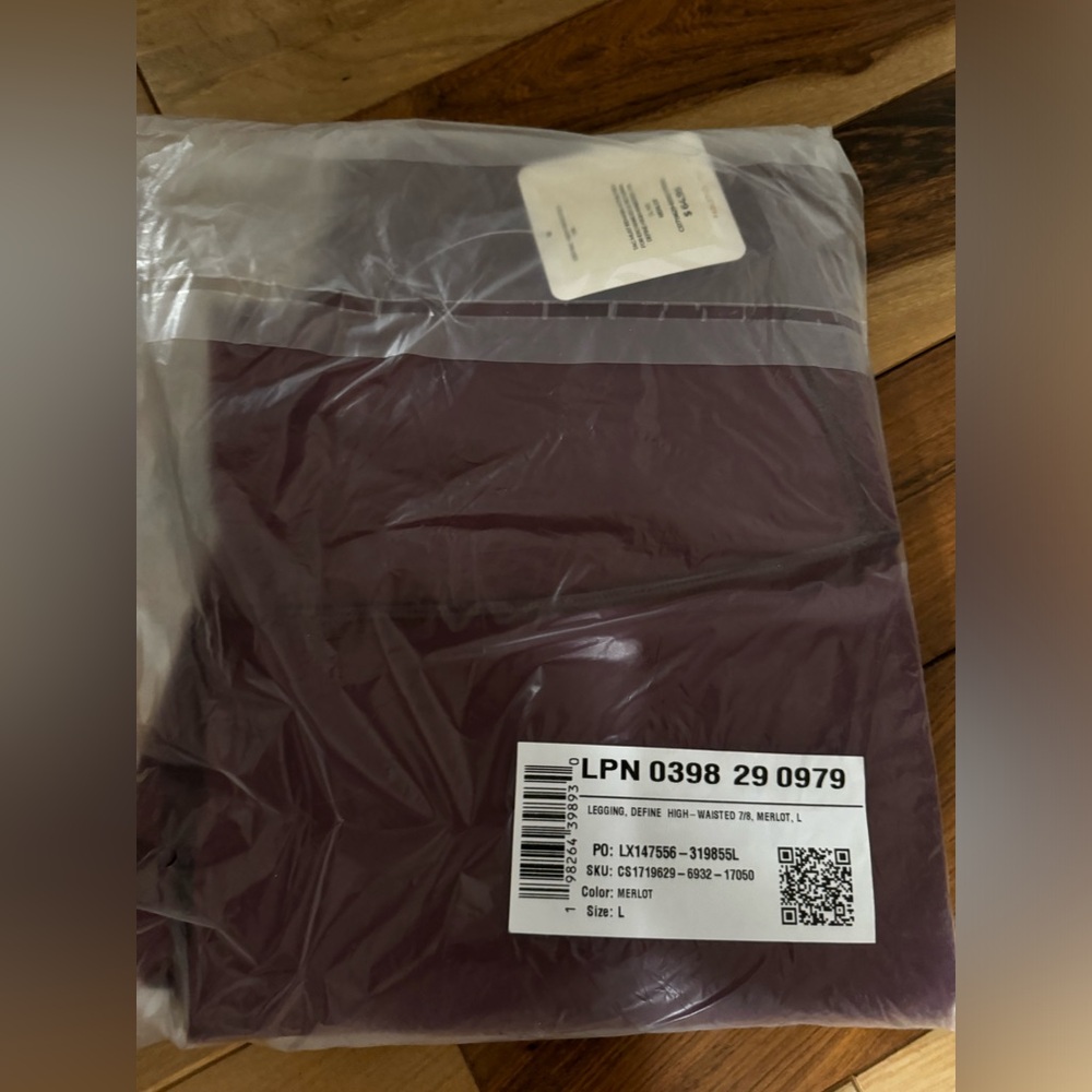 2 pair of Fabletics Wine colored leggings.